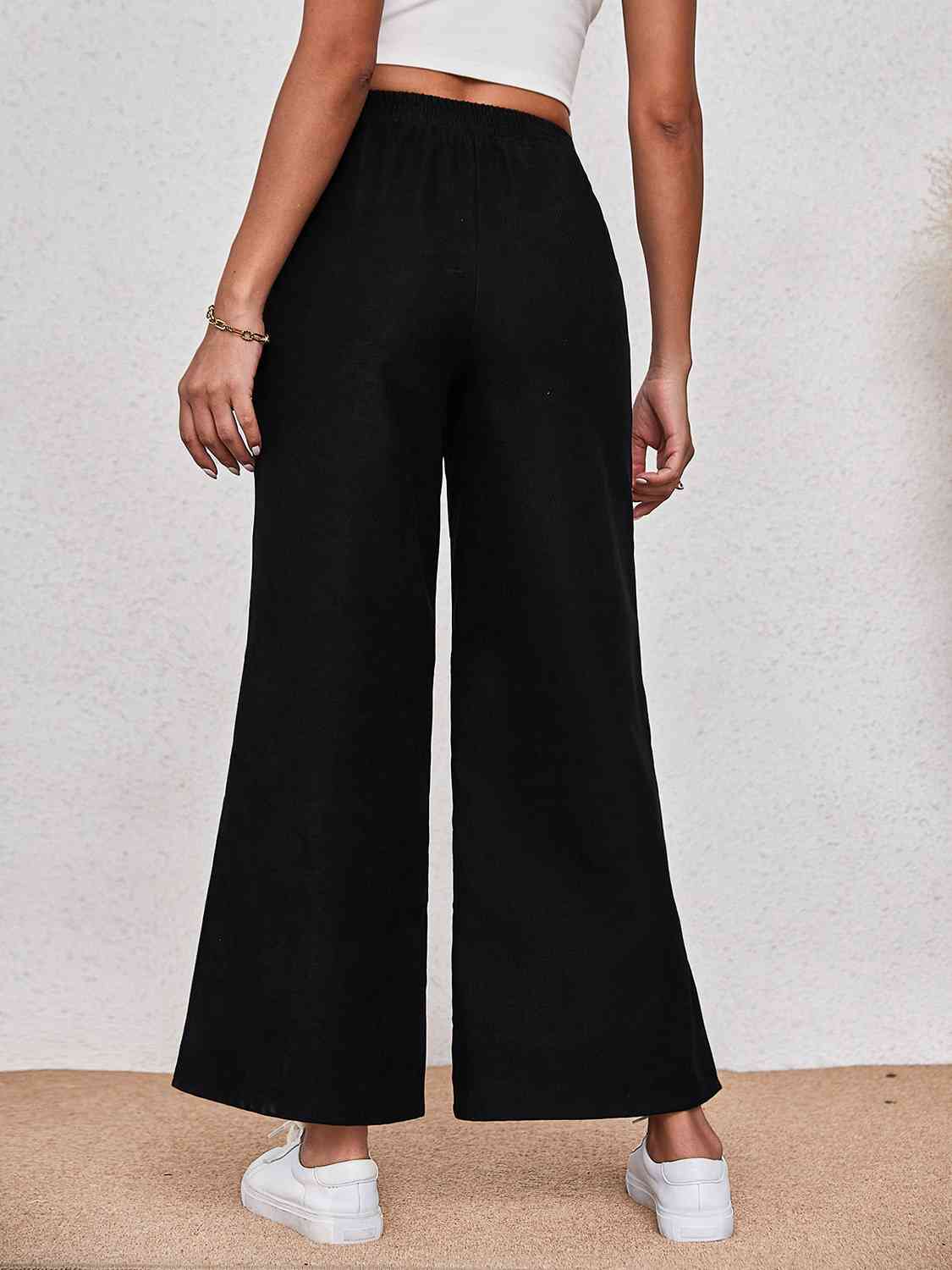 Pantalones anchos con abertura