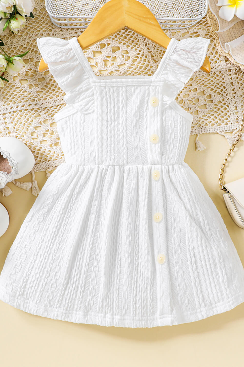 Bebé niña Vestido texturizado con hombros descubiertos y botones decorativos