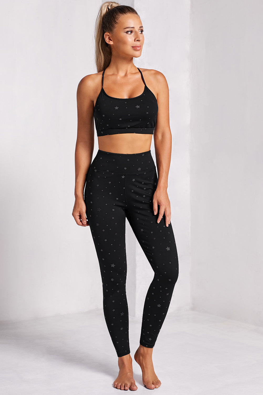 Conjunto de leggings y sujetador deportivo con estampado de estrellas