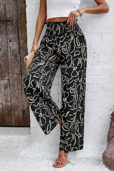 Pantalones anchos con estampado fruncido y bolsillos